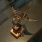 Bronze sculpture of a fish on a wooden base
