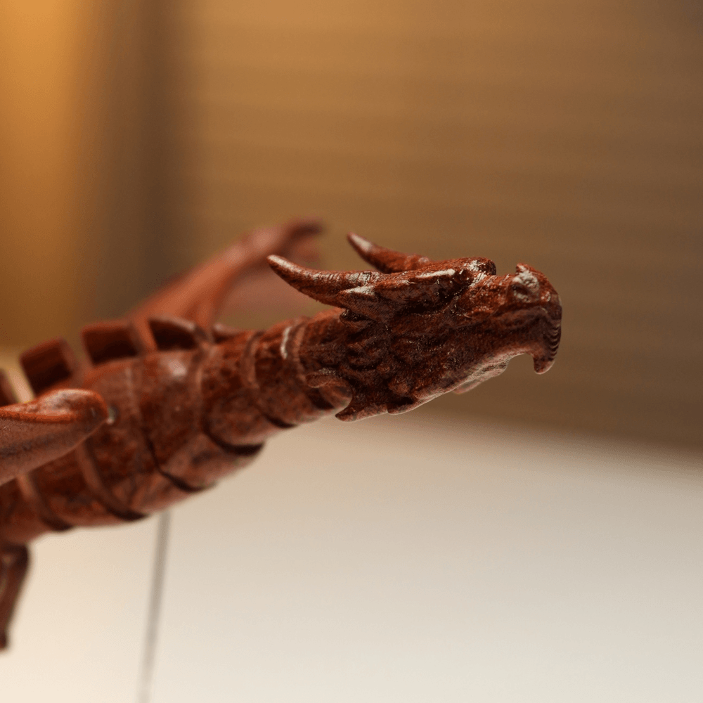 Close-up of the carved wooden dragon head, horns and articulated neck